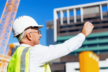 Engineer builder at construction site