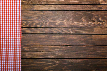 Wall Mural - Checkered napkin on wooden background