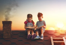 Children Reading A Book