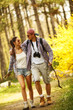 © BalanceFormCreative - Young couple hiking in nature on beautiful summer day.