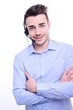 © W PRODUCTION - handsome young man hotline call center service operator on phone call with a customer