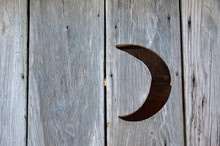Crescent Moon In An Outhouse Wall
