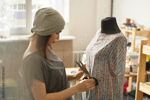 Fotografia, Obraz The dressmaker is a dummy and holding a pair of scissors in the Studio