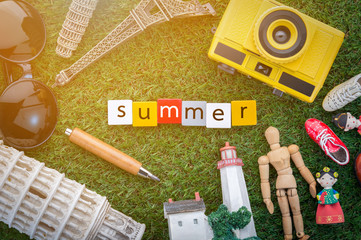 summer concept with souvenir on grass floor