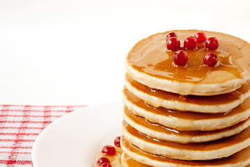 Wall Mural - Pancakes with maple syrup and cranberries. Pancake's Day 