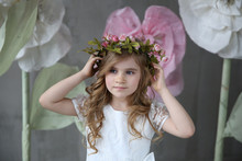 Little Girl With Flower Diadem On Her Head