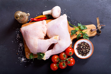 fresh raw chicken legs with vegetables