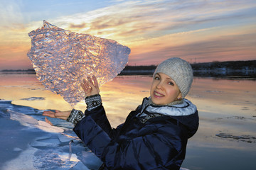 Wall Mural - Beautiful woman with a patterned piece of ice.