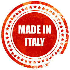 Made in italy, grunge red rubber stamp on a solid white backgrou