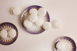 Top view of Latvian marshmallovs - zefiri on porcelain plates on white background, vintage filter