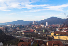Kamnik, Slovenia - January 25, 2016. Roofs Of Town Kamnik With Towering Church Of The Immaculate Conception And Zaprice Castle Over Them.