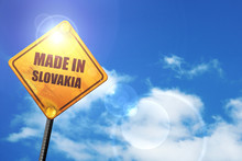 Yellow Road Sign With A Blue Sky And White Clouds: Made In Slova