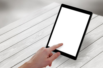 Poster - Man hand touch tablet screen on wooden desk. Isometric view