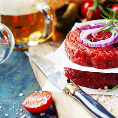 Wall Mural - Beer and Raw Ground beef meat Burger steak cutlets with seasonin