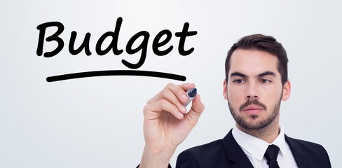 Wall Mural - Composite image of focused businessman writing with marker