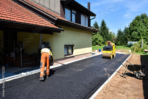 Fotografie, Obraz Team of Workers making and constructing asphalt road constructio