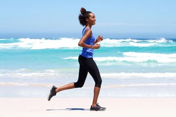 Active young woman running outdoors