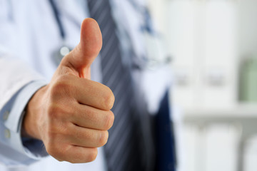 Wall Mural - Male medicine doctor holding document pad in hand showing OK