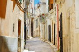 Fototapeta Na drzwi - Typical medieval narrow street in beautiful town of Conversano
