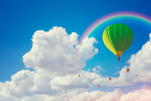 Colorful Hot Air Balloons And Rainbow With Cloudy Blue Sky Background