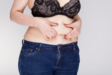 Fototapeta  - Womans fat belly