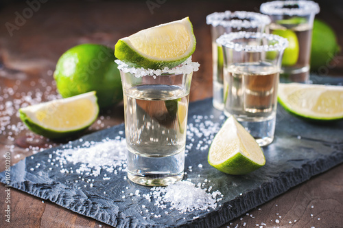 Cuadros en Lienzo Tequila gold, Mexican, alcohol in shot glasses, lime and salt, toned image, sele