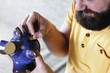 © alexkich - putting a coin piggy bank
