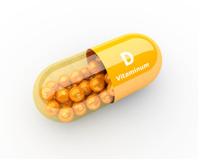 Vitamin D Capsule Lying On Desk