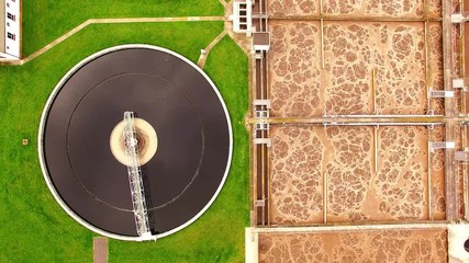 Wall Mural - Aerial view to biogas plant from sewage treatment in green fields. Renewable energy from biomass. Waste management for 165, 000 inhabitants of Pilsen city in Czech Republic, Europe. 