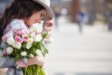 Canvas Print - Woman with tulips. Beautiful woman with flowers.