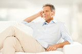 Fototapeta Panele - handsome businessman Relax on the couch at home