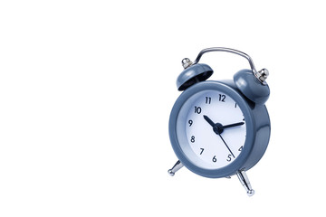 Metal Alarm clock work time on white background