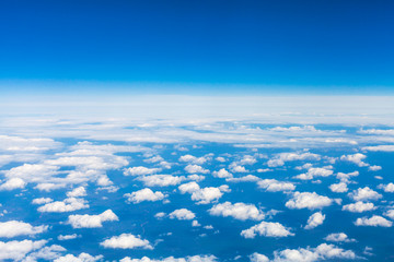 Wall Mural - above view many little clouds in sky from airplane