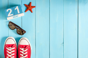 Wall Mural - May 21st. Image of may 21 wooden color calendar on blue background.  Spring day, empty space for text