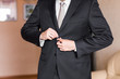 © satura_ - Business man or Groom wearing suit on wedding day and preparing.
