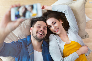 Wall Mural - Couple taking selfie with phone