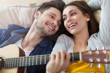 Wall Mural - Couple playing guitar