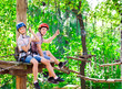 © davit85 - adventure climbing high wire park - people on course in mountain
