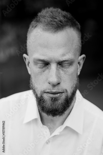 Portrait Of Young Red Hair Man With Closed Eyes Beard Black And