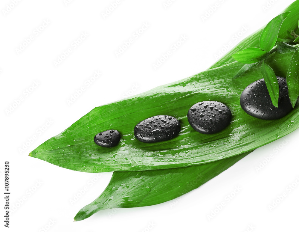 Hot spa stones with bamboo, isolated on white