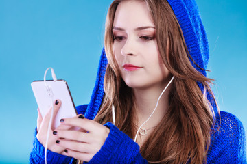 Wall Mural - young woman with smart phone listening music