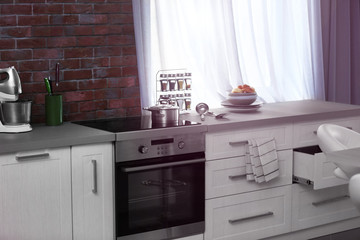 Sticker - Modern kitchen interior with white furniture and electric stove