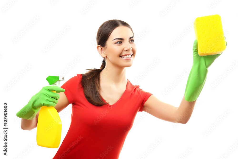 Young woman holding sponge and detergent spray, isolated on white