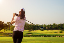 Asian Woman Golfer Hit Sweeping Golf Course In The Summer