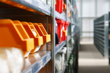 Storage bins and racks in an industrial warehouse shot with shallow focus