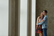 © Diflope - man and woman near a large window.