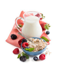 Wall Mural - Rolled oats in a bowl with berries and milk