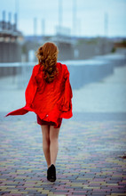 Redhead Girl Is Walking On The Heels