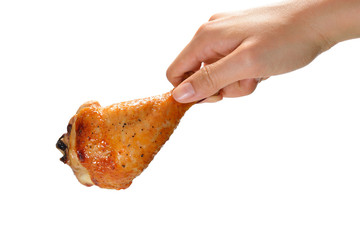 Poster - Hand holding grilled chicken leg isolated on white background