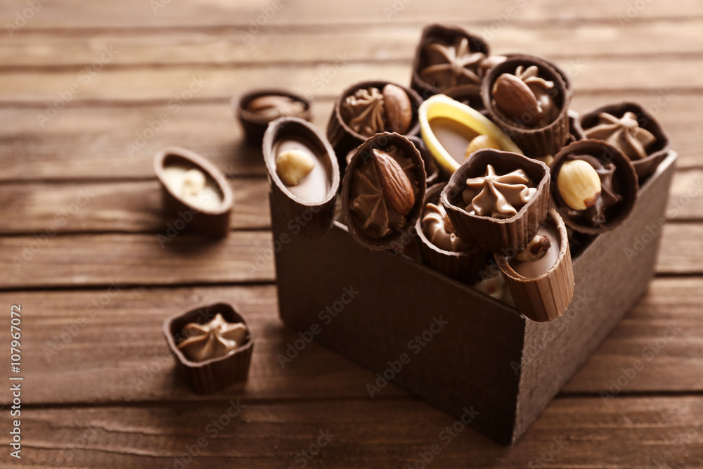Chocolate sweets on wooden background
